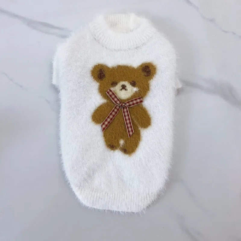 Wool pet sweater with bow tie and bear design in purple, pink, green-blue, or white, sizes XS to XXL.