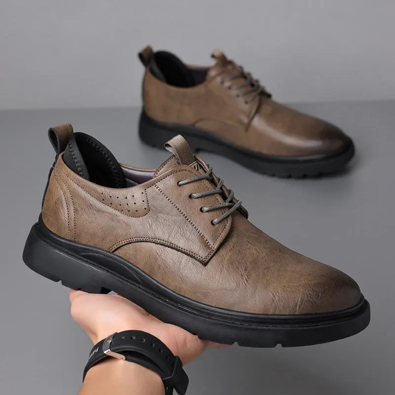 Men's black and brown leather shoes with sewn detailing and rubber sole