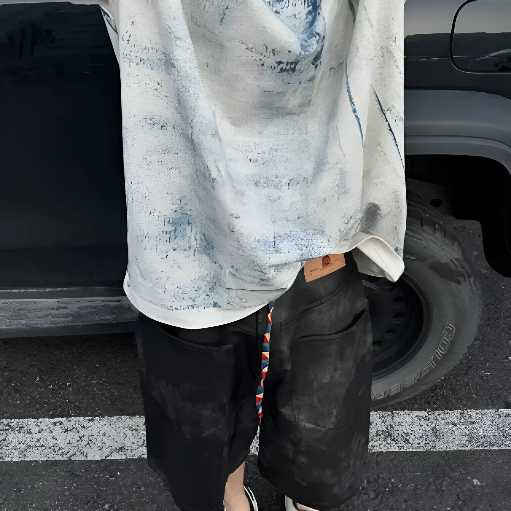 Korean style loose fit tie-dye printed t-shirt on a solid colour background.