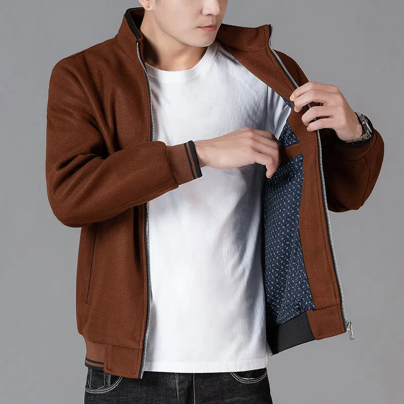 Men's grey sport-style fleece jacket with long sleeves on a hanger.