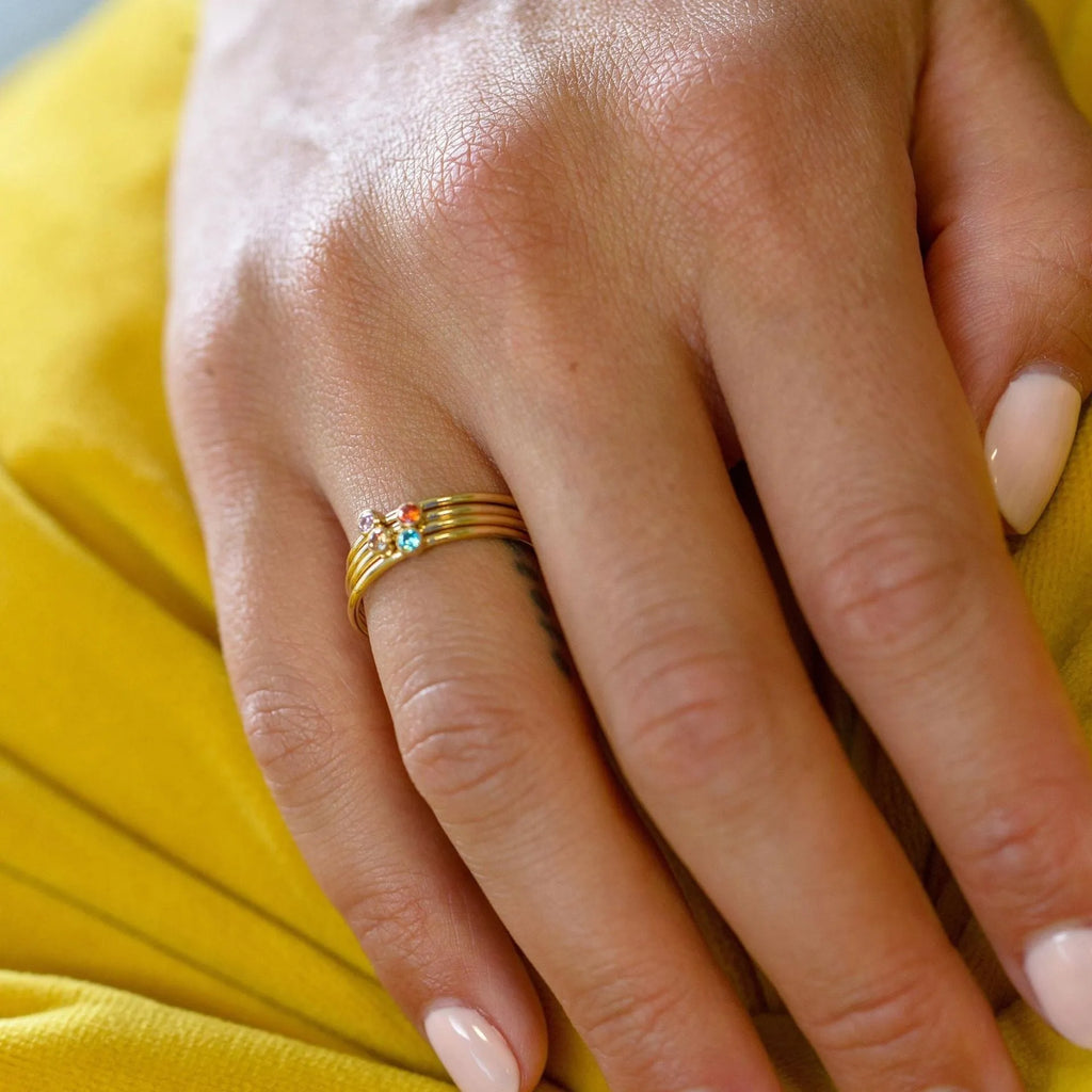 Geometric stacking ring for women with December birthstone colour and gold electroplated finish.