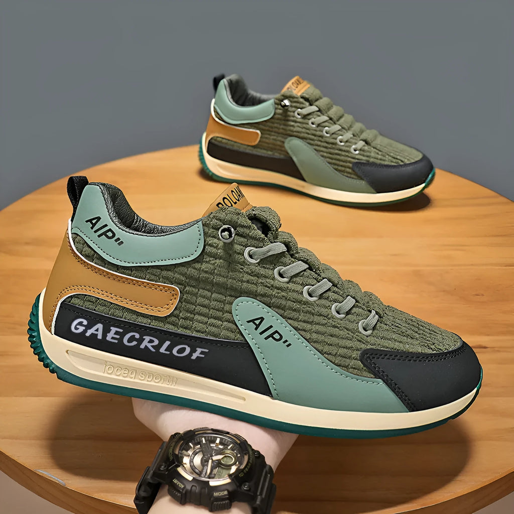 Men's grey and green low-top mesh running shoes with lace-up front.