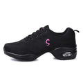 Women's breathable flyknit mesh dance shoes with a light PU sole on a wooden floor.