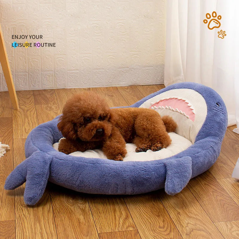 Blue shark pattern pet bed for dogs and cats on a wooden floor, showing plush velvet material.