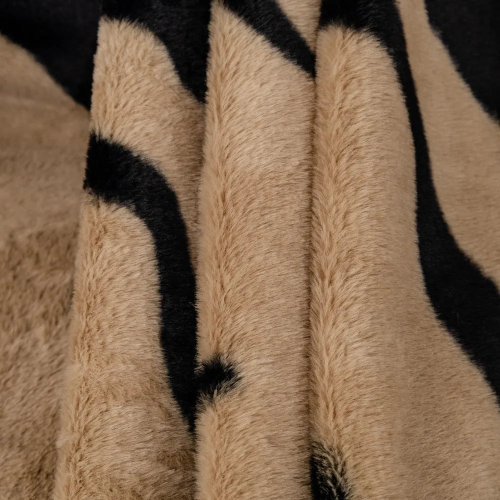 Zebra pattern flannel sofa cover and pillowcase in caramel colour on a sofa