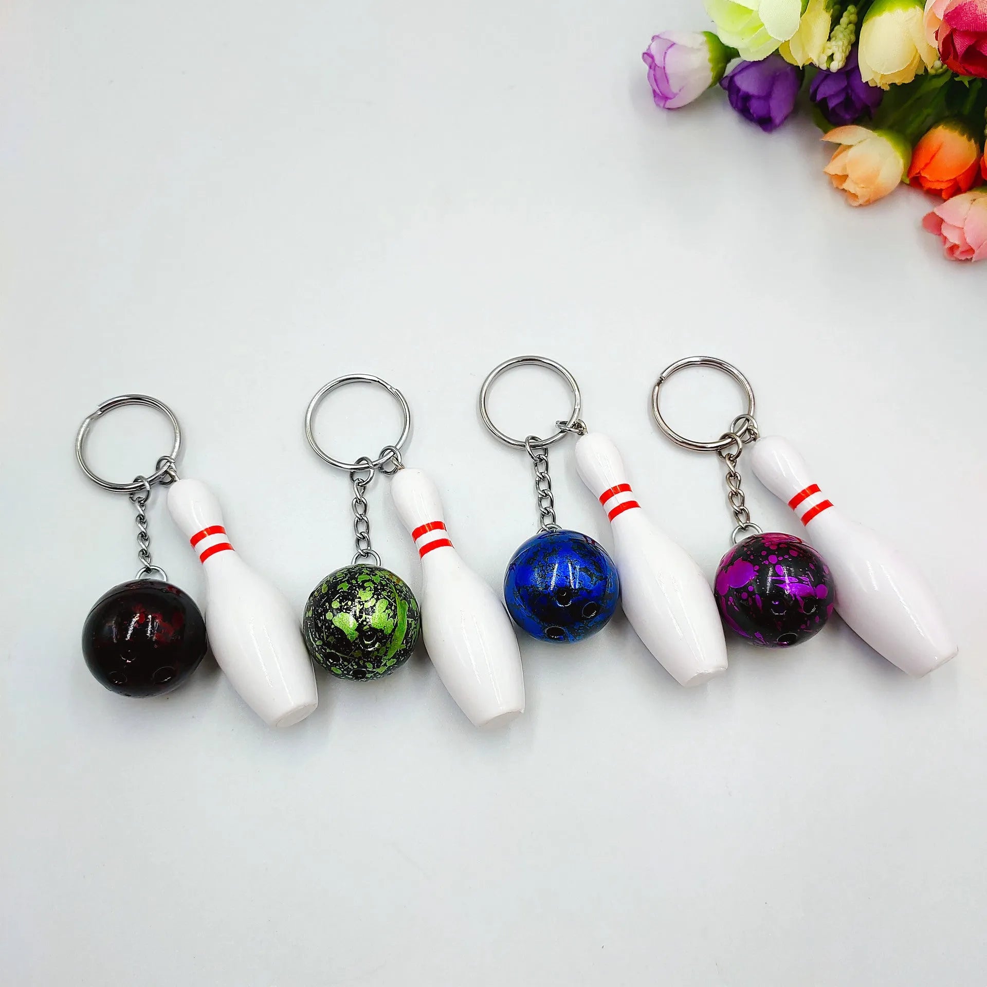 Mini simulation bowling ball keychain pendant with metal clip in blue, red, purple, and green colours