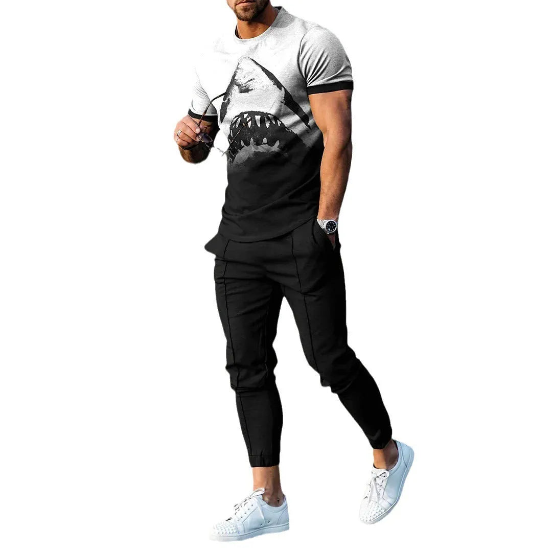Man wearing a short sleeve printed pullover and matching trousers from a men's two-piece sports set.