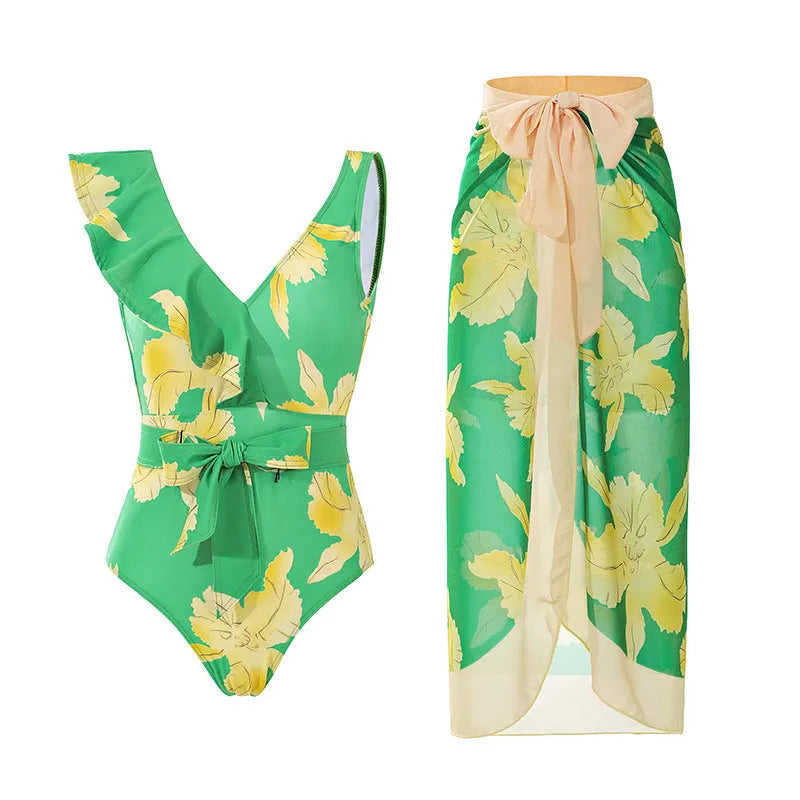 Women's solid colour one-piece swimsuit with spaghetti straps and a matching removable skirt.