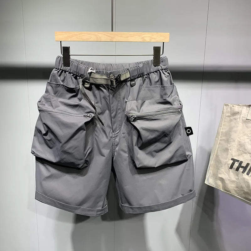 Men's loose fit workwear shorts in black or grey with pockets and straight leg hem available in large sizes