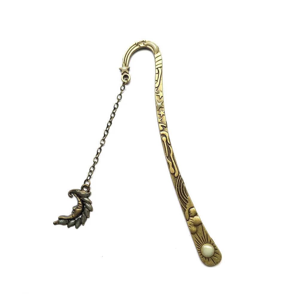 Retro five-pointed star glowing metal bookmark in ancient silver or bronze with sun, moon and stars design