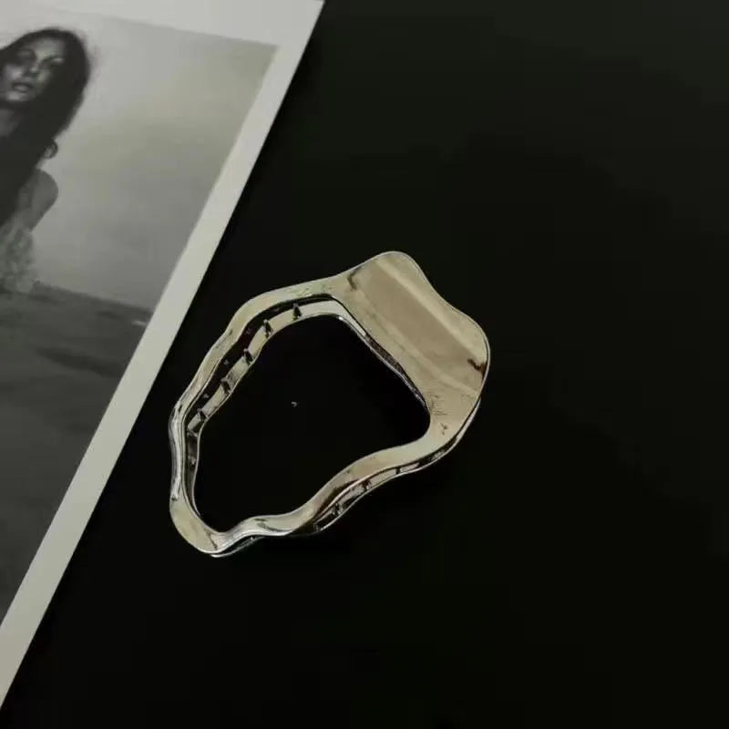 Gold and silver zinc alloy hair barrettes showing arc, square, and triangle shapes on a white background.