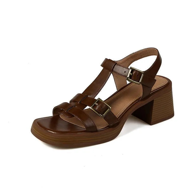 Black women's retro sandals with T-shaped buckle, open toe, chunky platform heel, and square toe shape.
