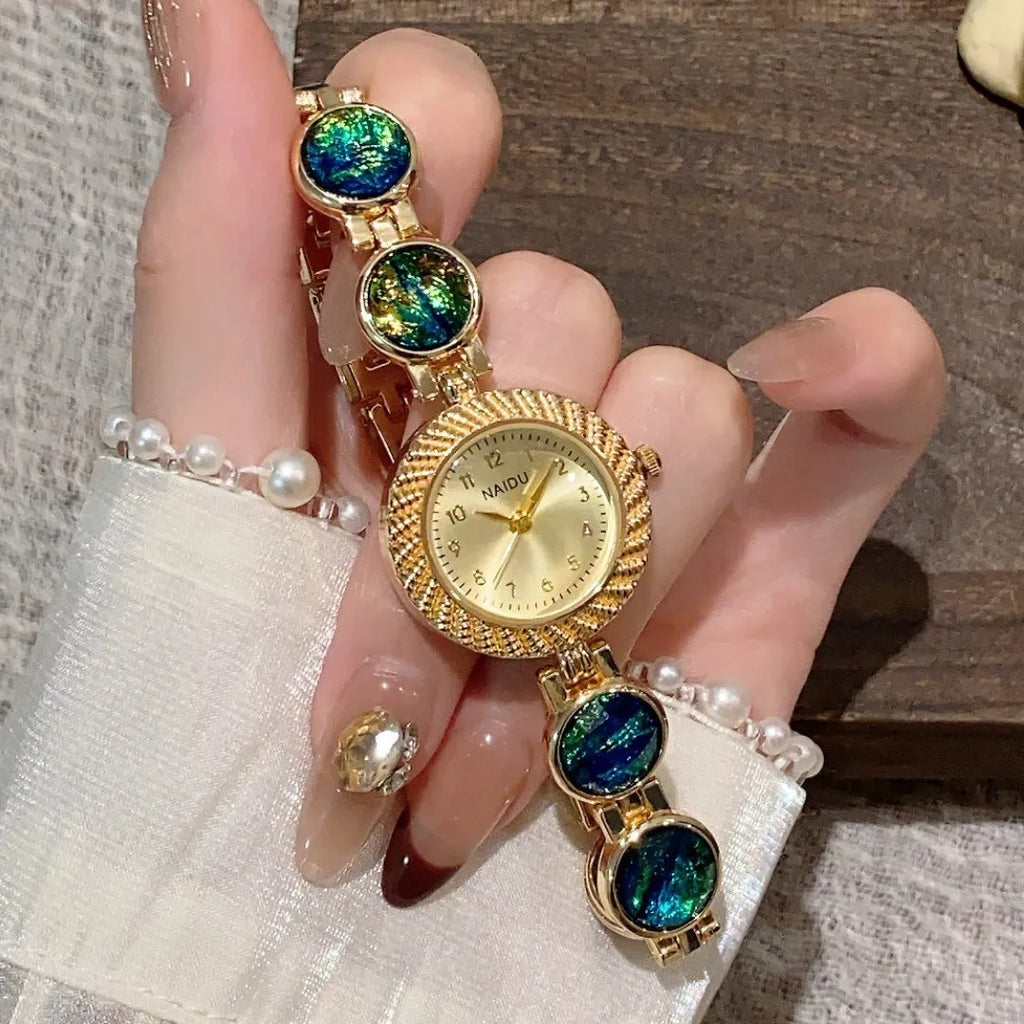 Women's quartz watch with a round 25mm dial in a choice of six colours on a wrist.