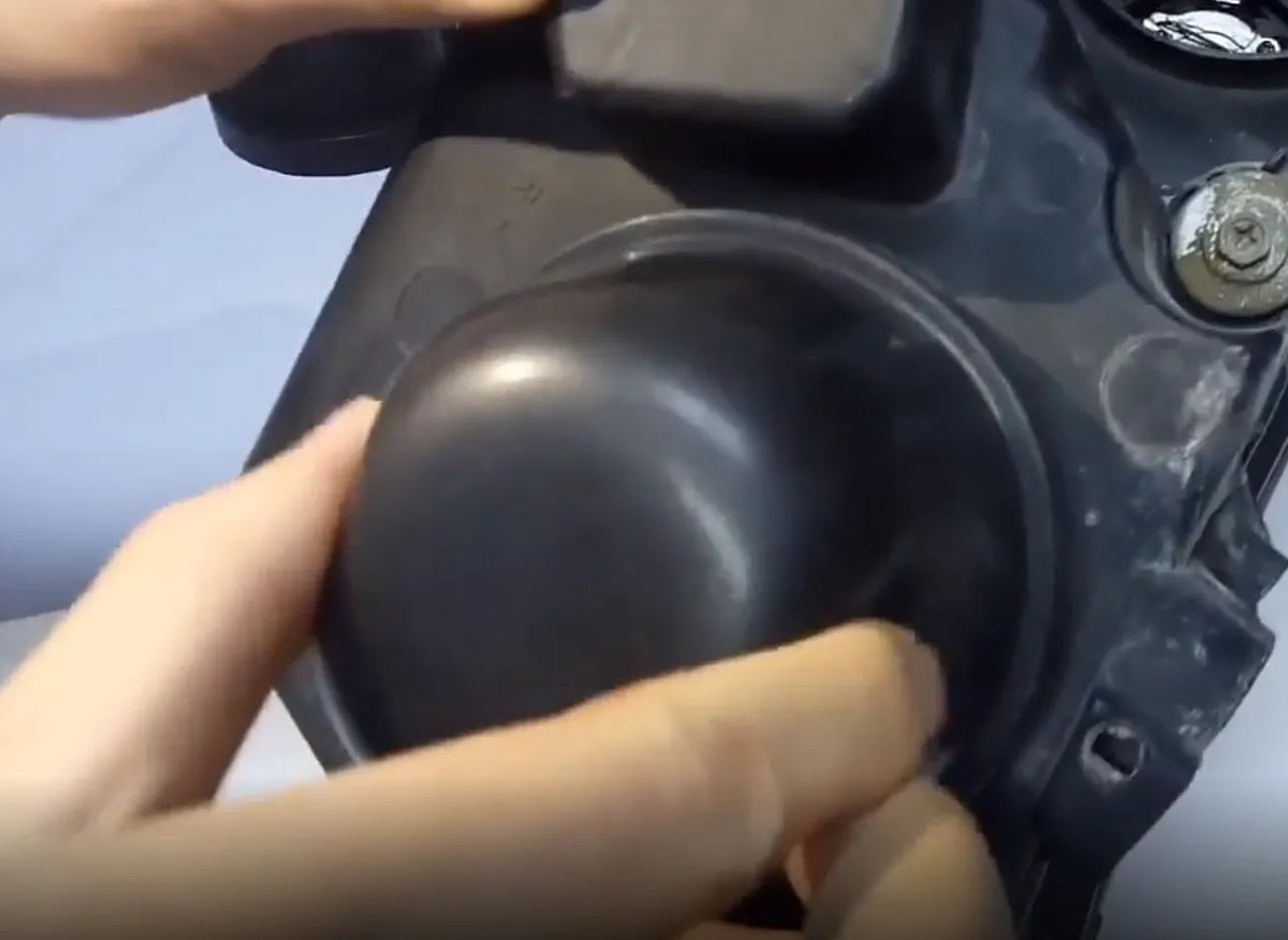 Black silicone 90mm dust cover for General Motors car headlight rear seal protection.