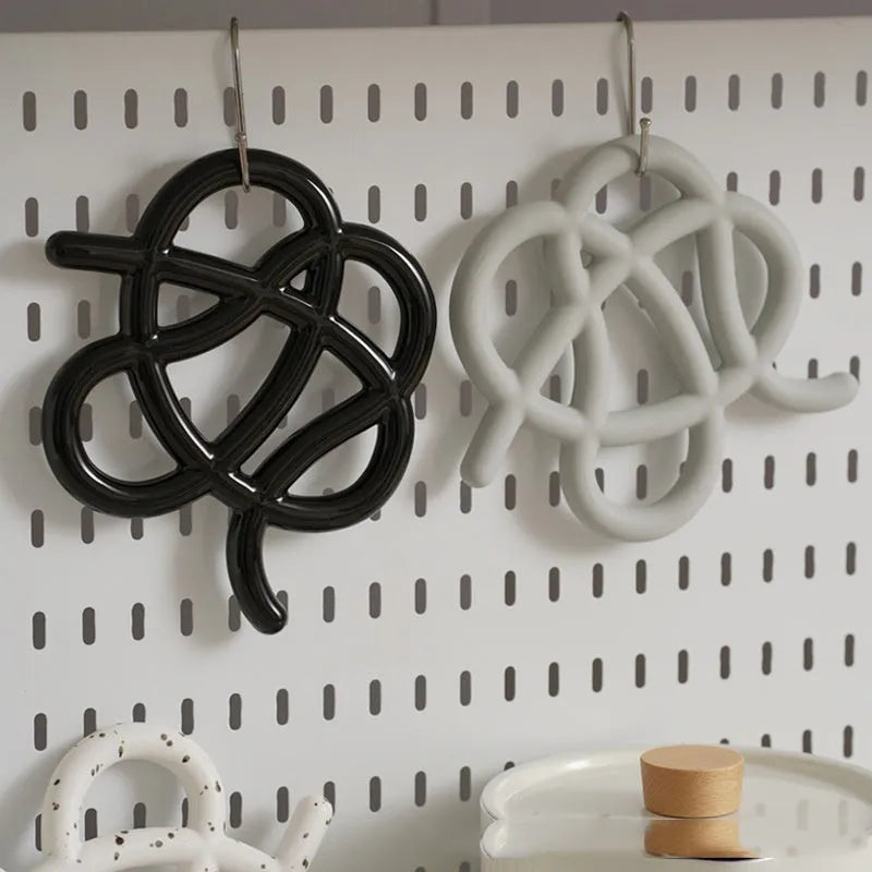 Ceramic heat proof mat with irregular shape on dining table