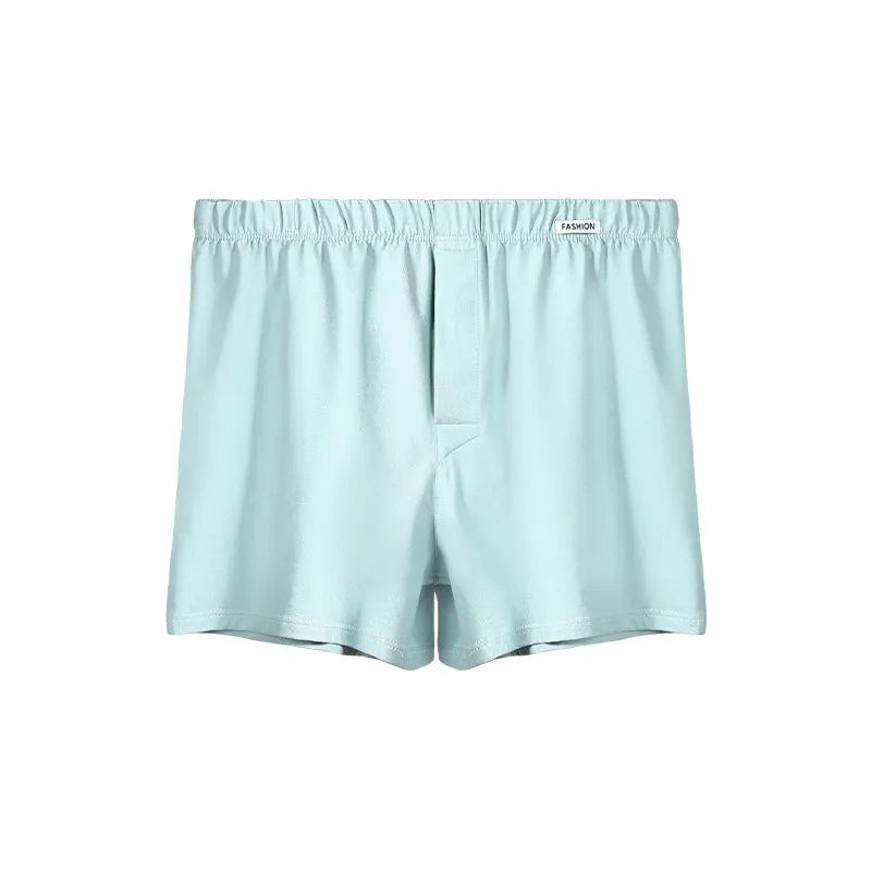 Men's loose-fitting cotton boxers in solid colours: gold, green, sea blue, and light grey.
