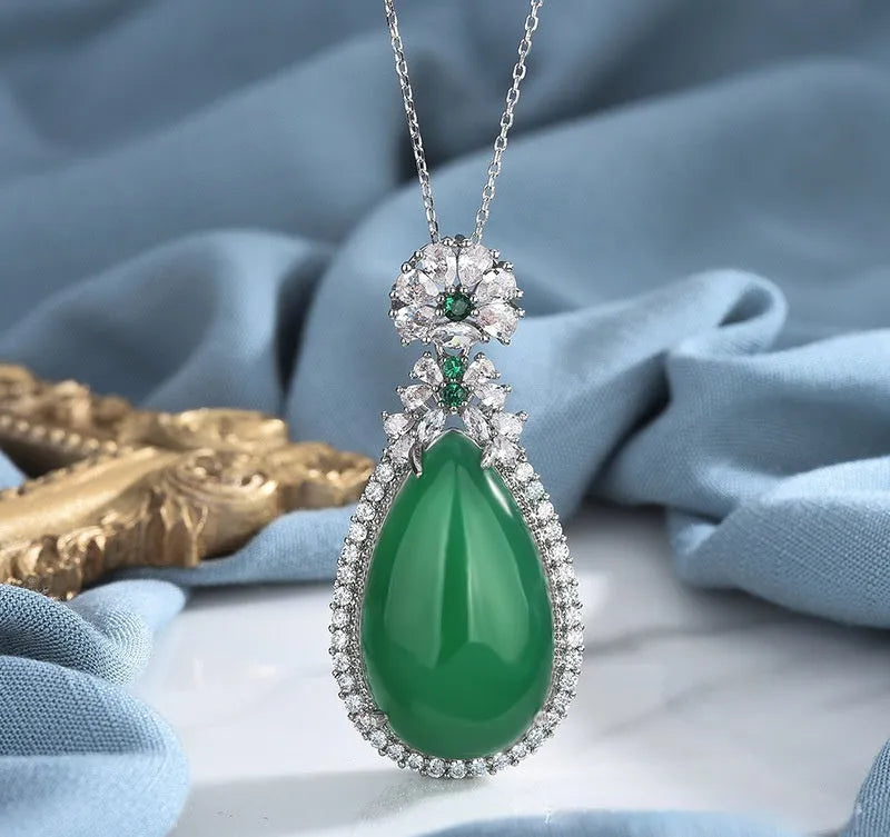 Green chalcedony water drop pendant with inlaid stone and electroplated copper geometric ellipse setting