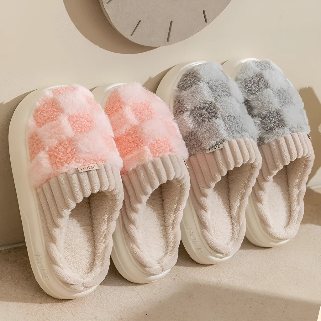 Women's plaid patterned plush slippers with a non-slip PVC sole, shown in a selection of colours including coffee, green, and pink.
