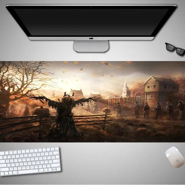 Oversized Halloween-themed gaming mouse pad on a desk, showing non-slip rubber cloth base.