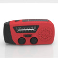 Red rechargeable emergency hand radio with built-in torch showing compact dimensions and wrist strap