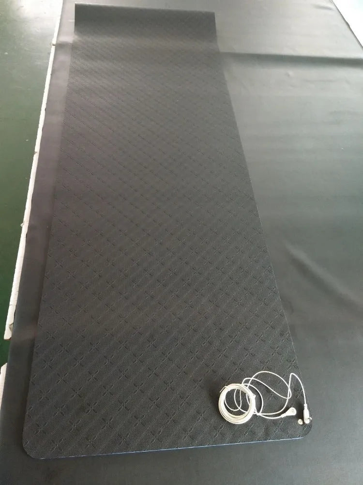 Blue conductive grounding yoga mat with plants pattern and integrated wire, 182cm long.