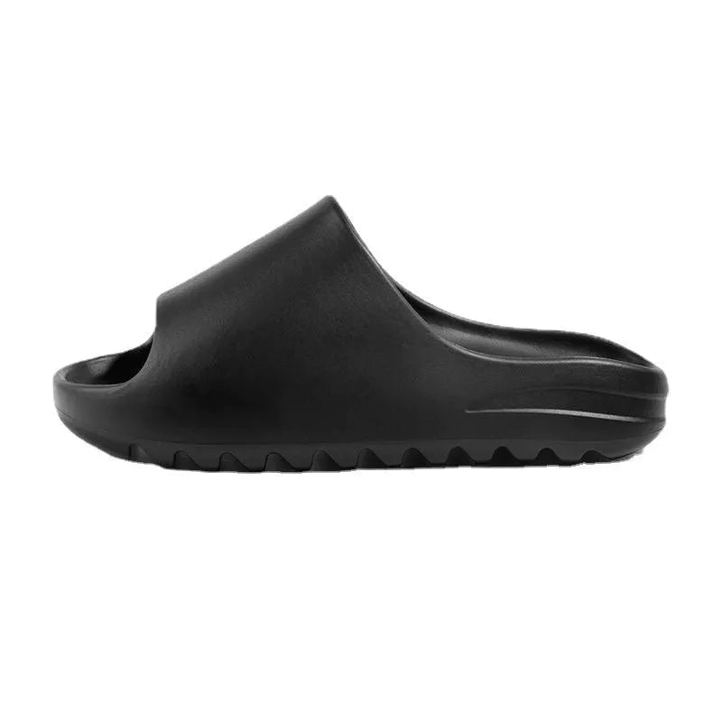 Women's thick sole beach slippers in black, green, and brown colours on a plain background