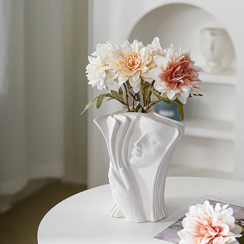 Ceramic book stand with glazed surface in one of four artistic designs: lover, dancer, beauty and beast, or brushed face