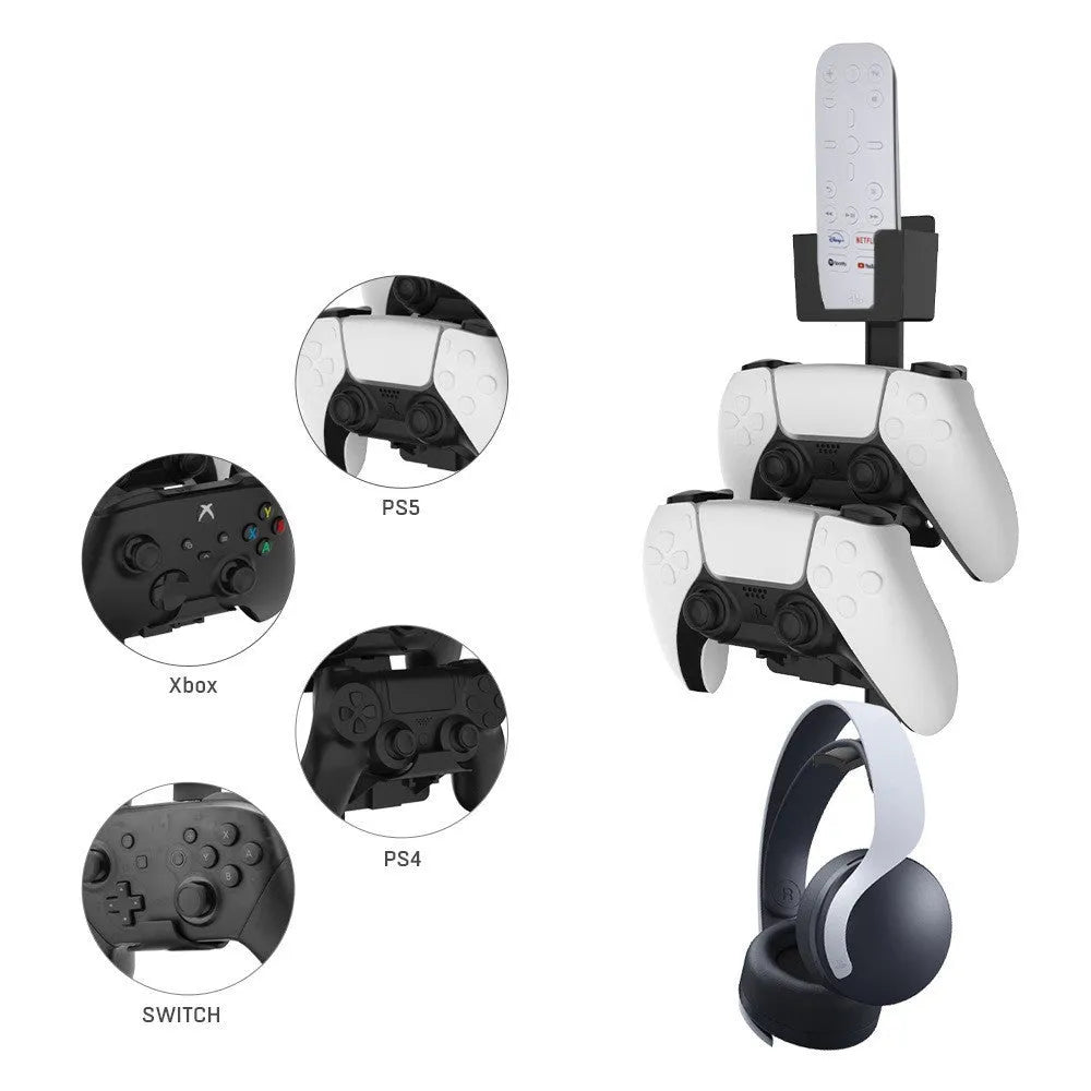 White wall-mounted plastic hook holding a game controller and a TV remote control.