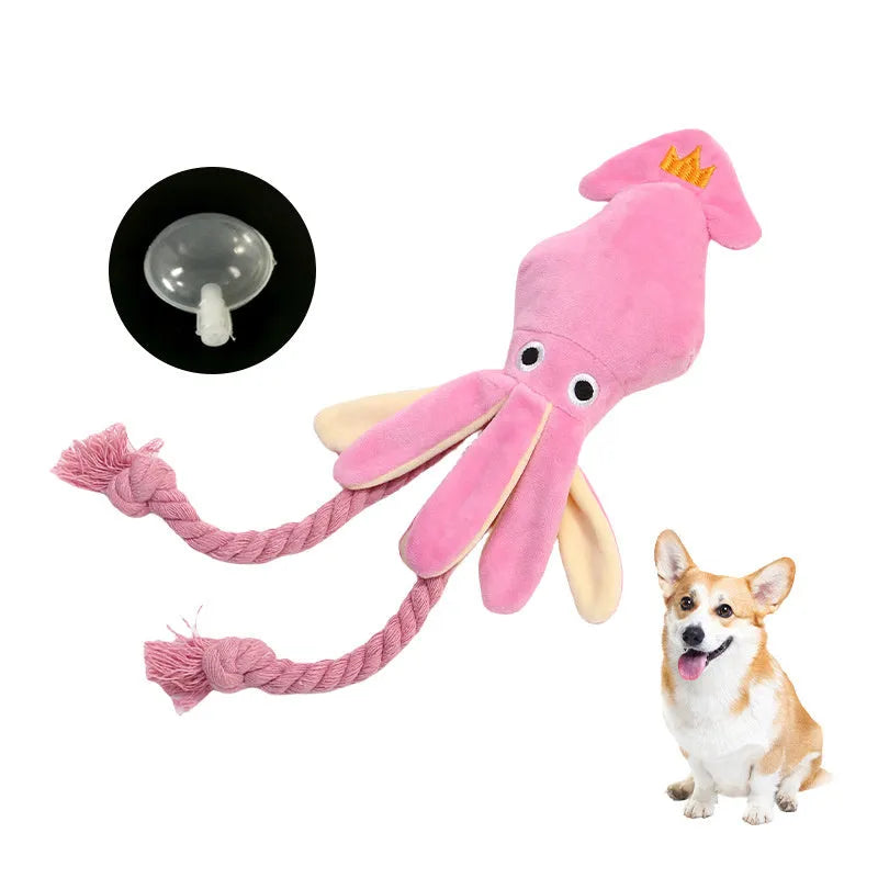 Pink plush squid pet toy with squeaker and rope tentacles