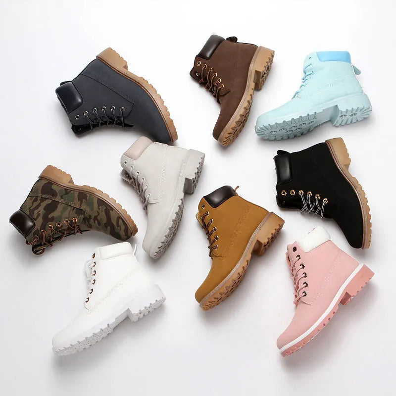 Pink high-top Martin boots with velvet lining, round toe, and front lace-up closure on a flat sole.