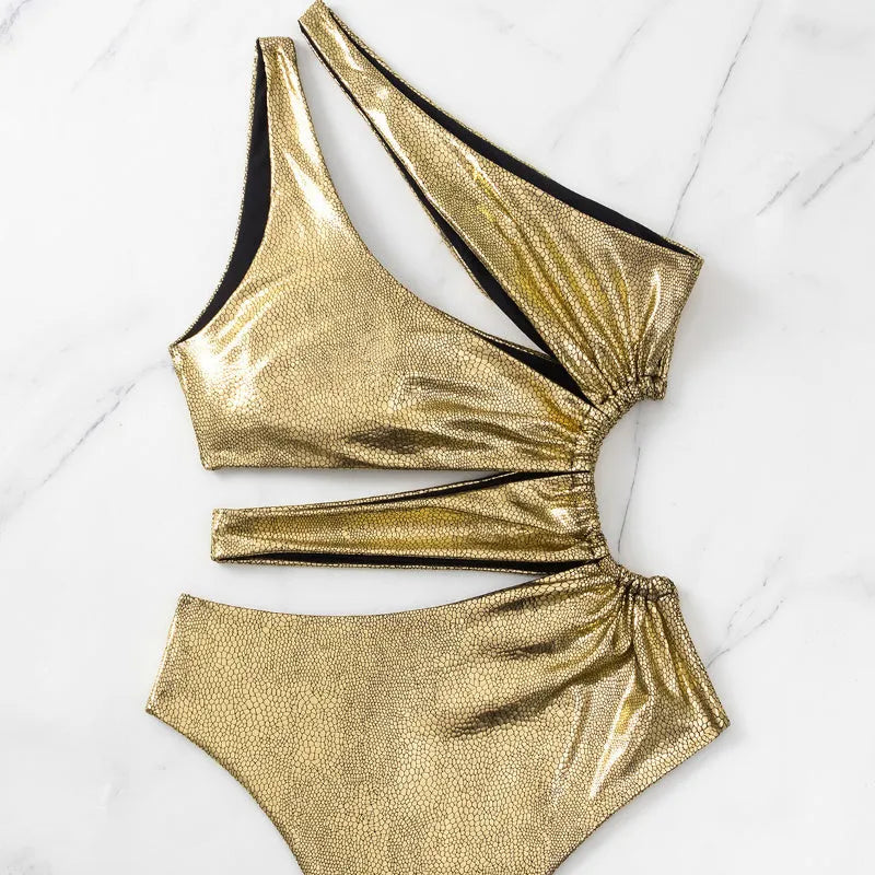 Women's gold backless one-piece swimsuit with sleeveless design for swimming activities