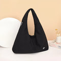 Soft heart-shaped nylon underarm bag for women in black, shown with a crossbody strap.