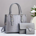 Women's PU leather three-piece crossbody set with wallet and card holder in burgundy colour