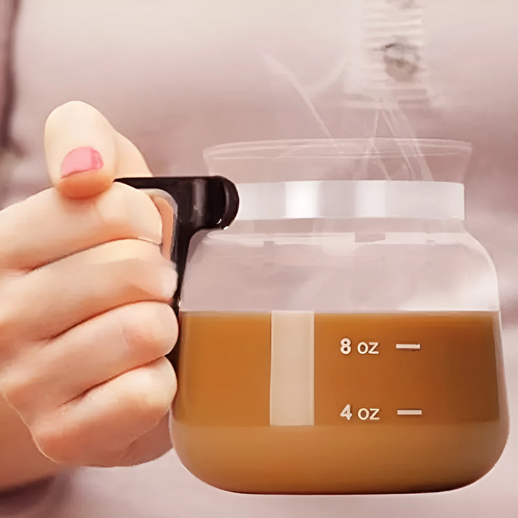 Transparent borosilicate glass coffee maker with silicone cover showing 355-473ml capacity markings