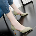 Women's black pointed toe stiletto high heels with a thin heel on a plain background.
