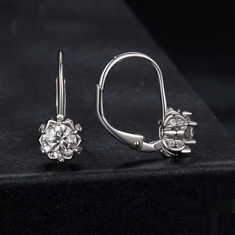Sterling silver flower bud clip earrings with white gold plating and 0.5 carat moissanite stone