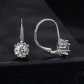 Sterling silver flower bud clip earrings with white gold plating and 0.5 carat moissanite stone