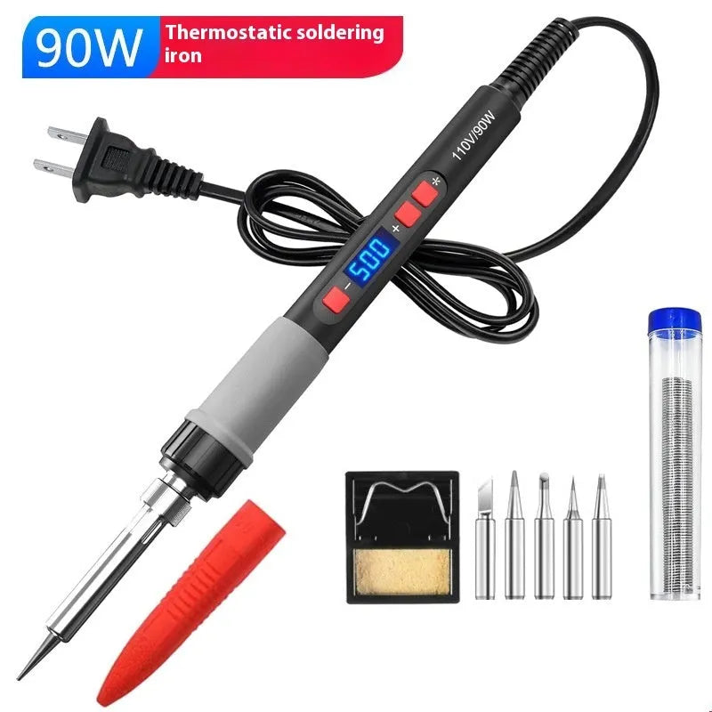 Grey 90W soldering iron kit with ceramic heating core, five tips, and accessories on a workbench.