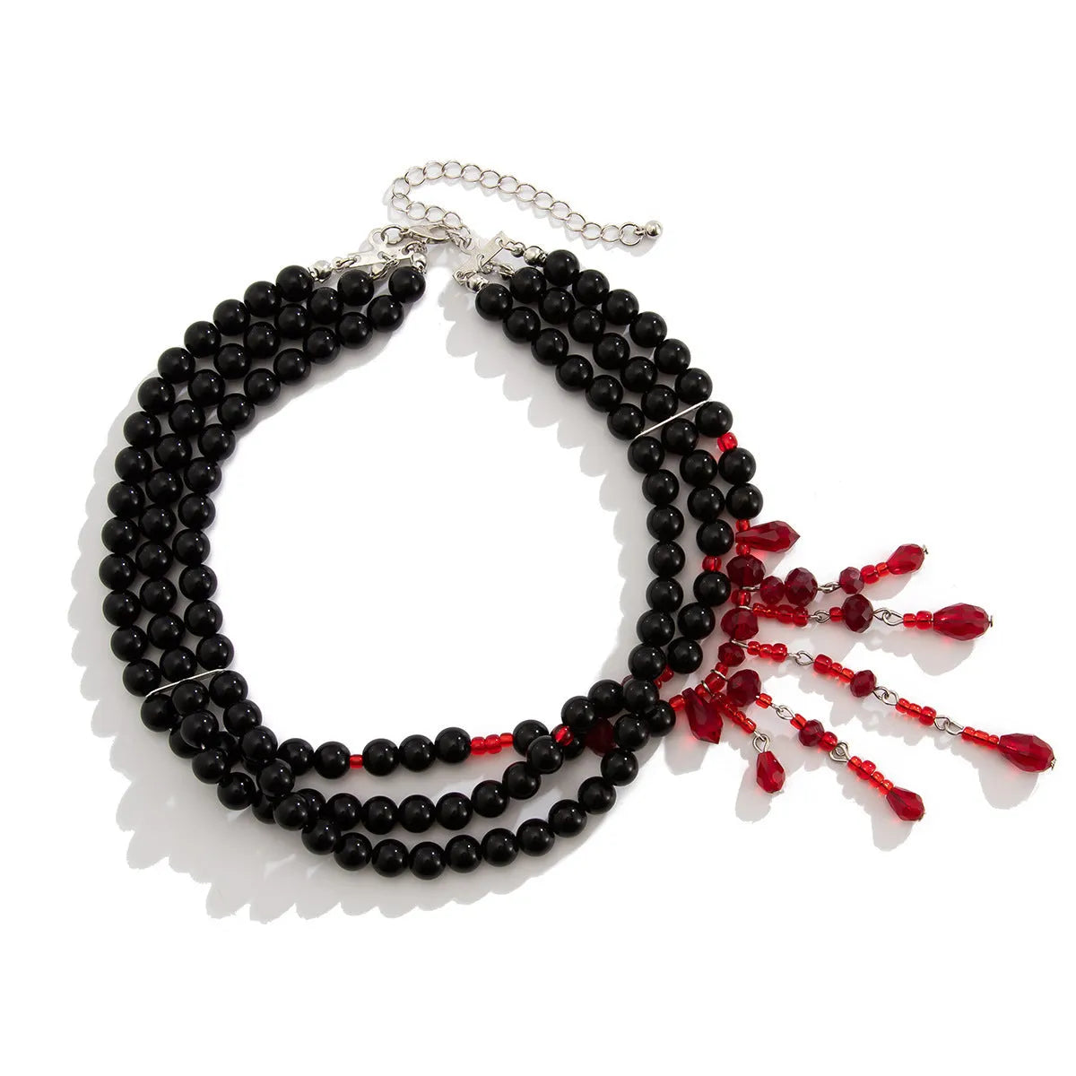 Men's blood drop tassel necklace with geometric crystal pendant and imitation pearls on a chain.