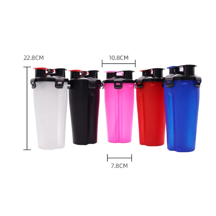 White portable pet water and food cup with bowl attachment on grass.