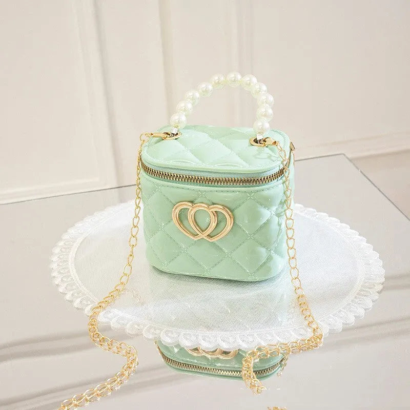 White PVC bucket handbag with a heart-shaped pattern