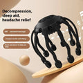 Black and white head massager with multiple claws and USB charging port showing four vibration mode settings
