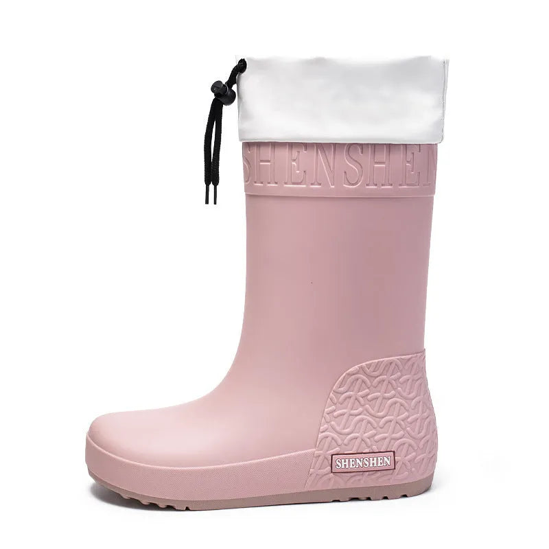 Women's solid colour PVC rain boots with non-slip sole in apricot, black, brown, or pink waterproof mouth.