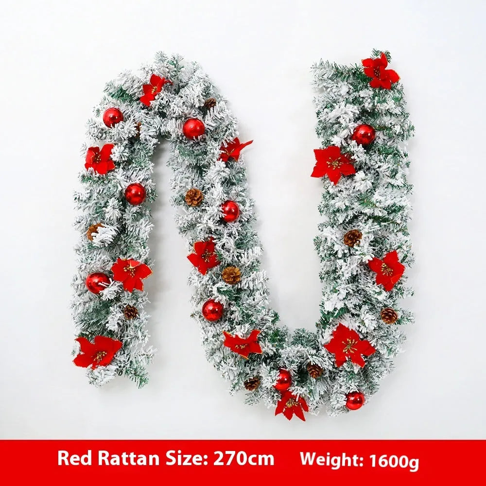 A long, flocked golden rattan Christmas garland draped in a swag on a mantelpiece.