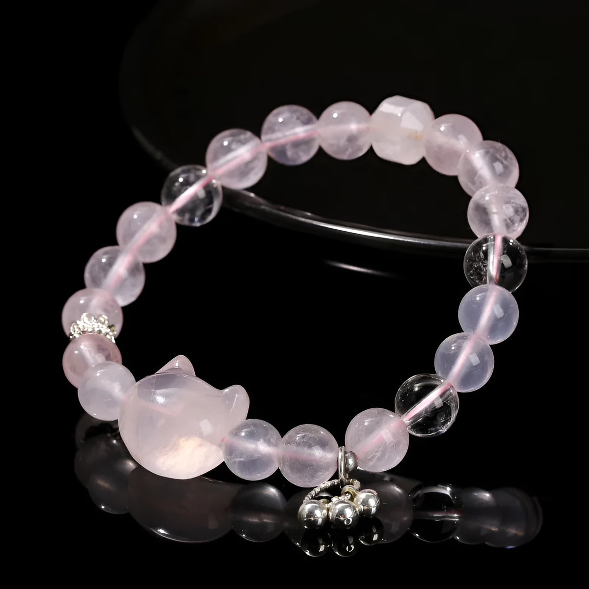Women's natural starlight pink crystal cat head bracelet with copper detail and geometric round beads