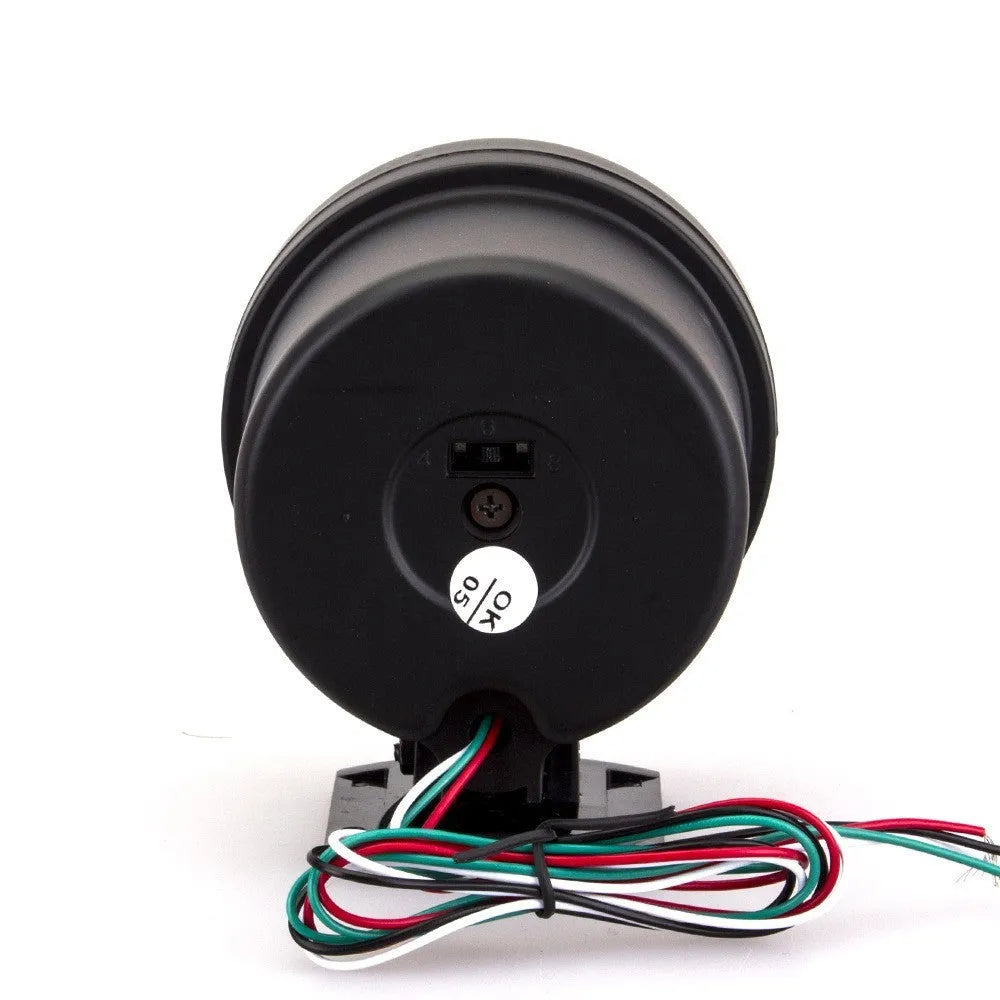 Black universal car tachometer with blue pointer on dial showing 0-8000 RPM range.