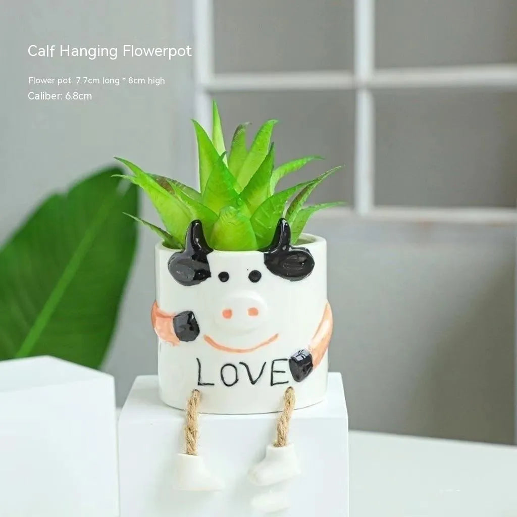 Ceramic hanging foot flowerpot in cartoon style for succulent plants on desktop