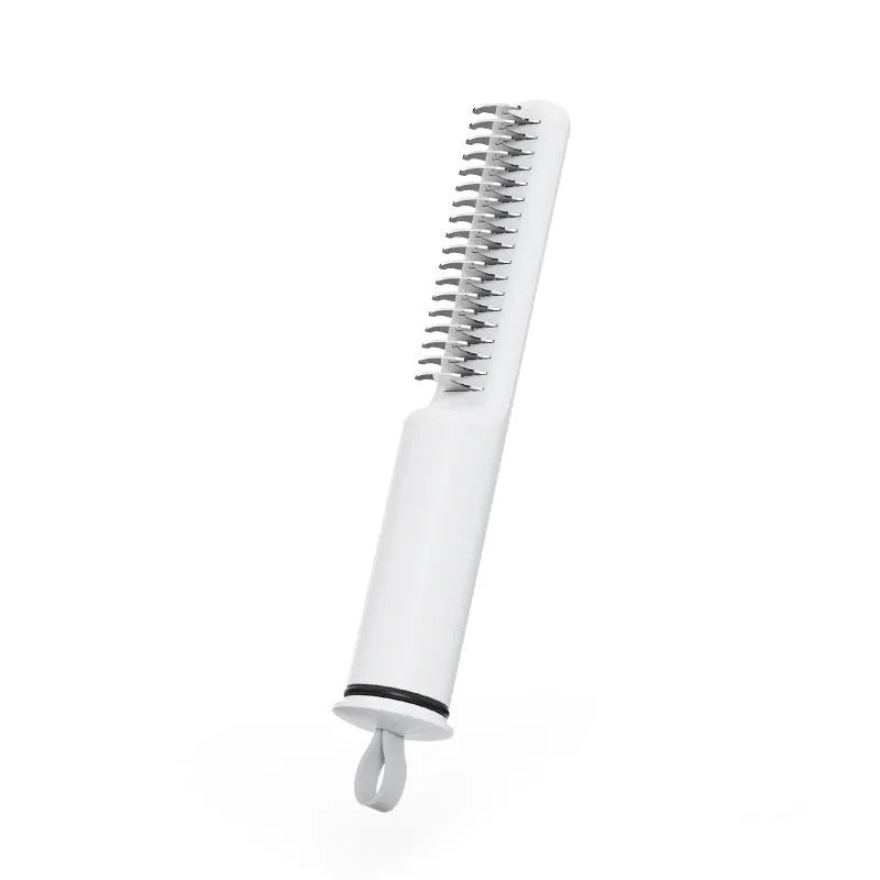 Stainless steel pet dematting comb with ergonomic handle in pink colour.