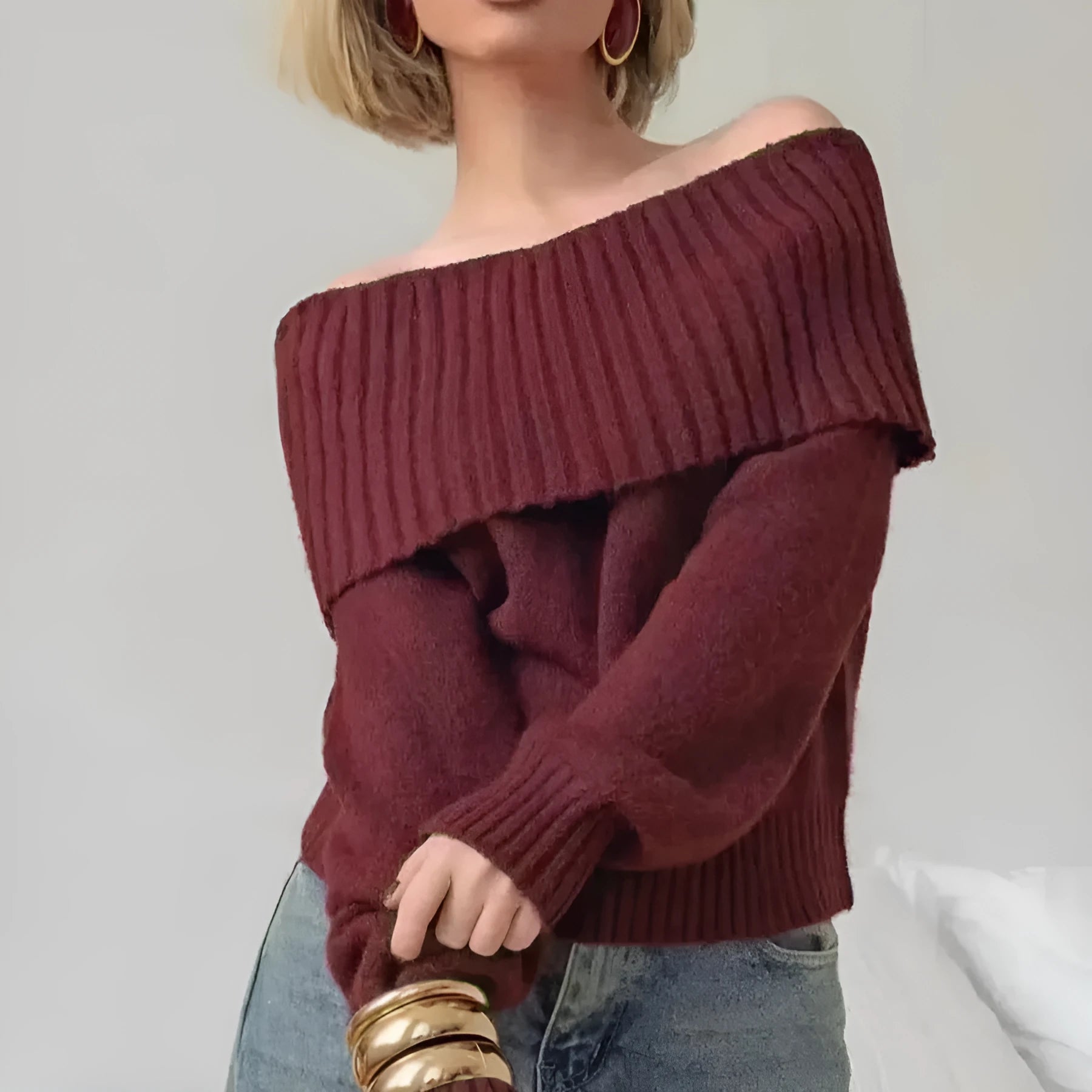 Grey off-the-shoulder strapless sweater with a raised 3D pattern texture.