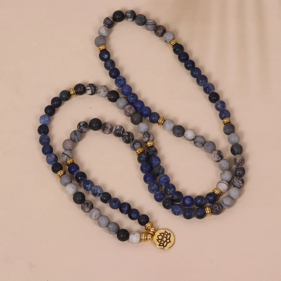 Blue multi layer bracelet with patterned network stone beads and alloy construction
